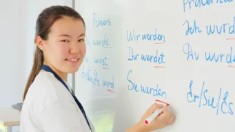 Students at the whiteboard in Berlin